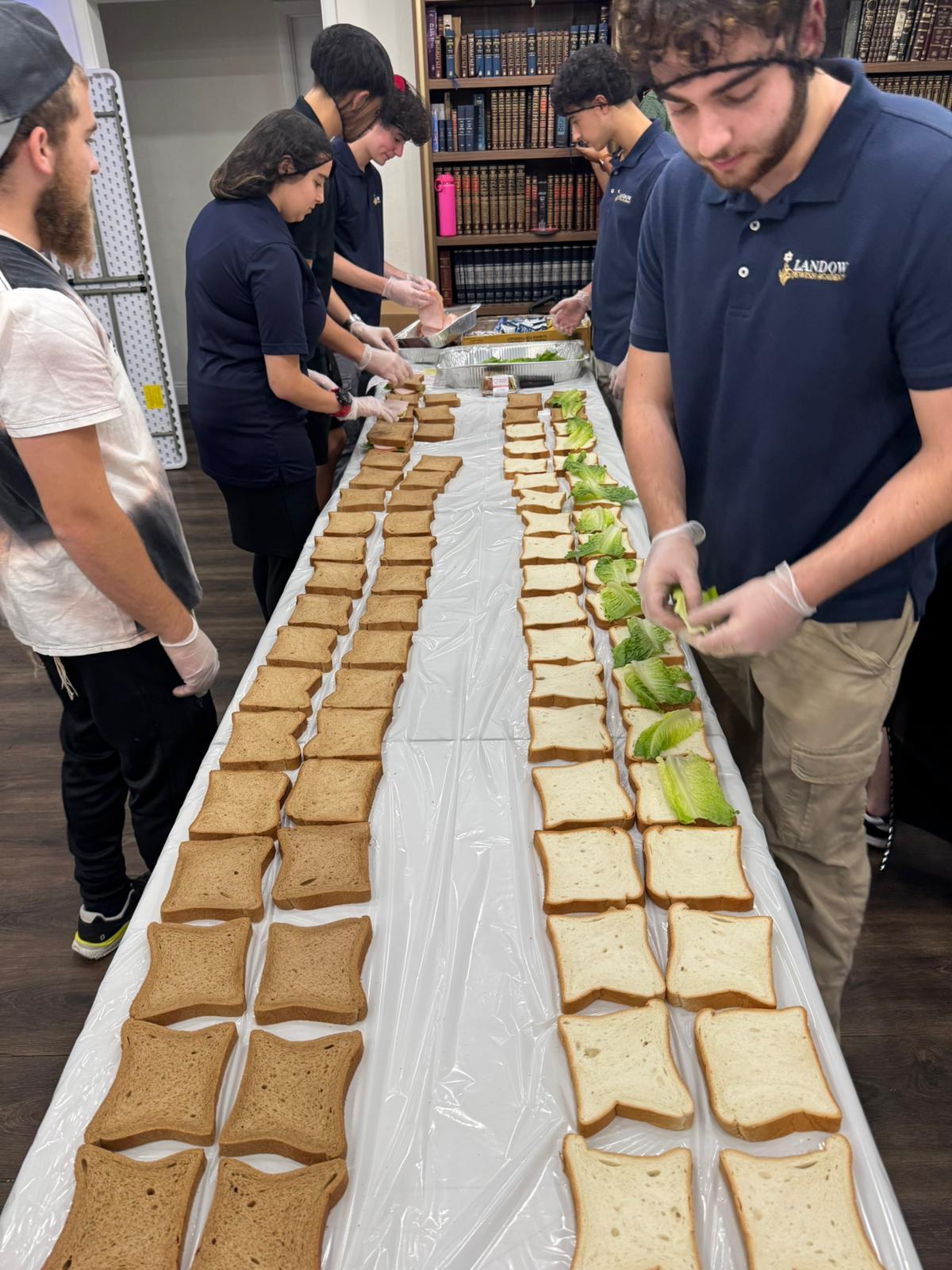 Landow students preparing sandwiches for community service