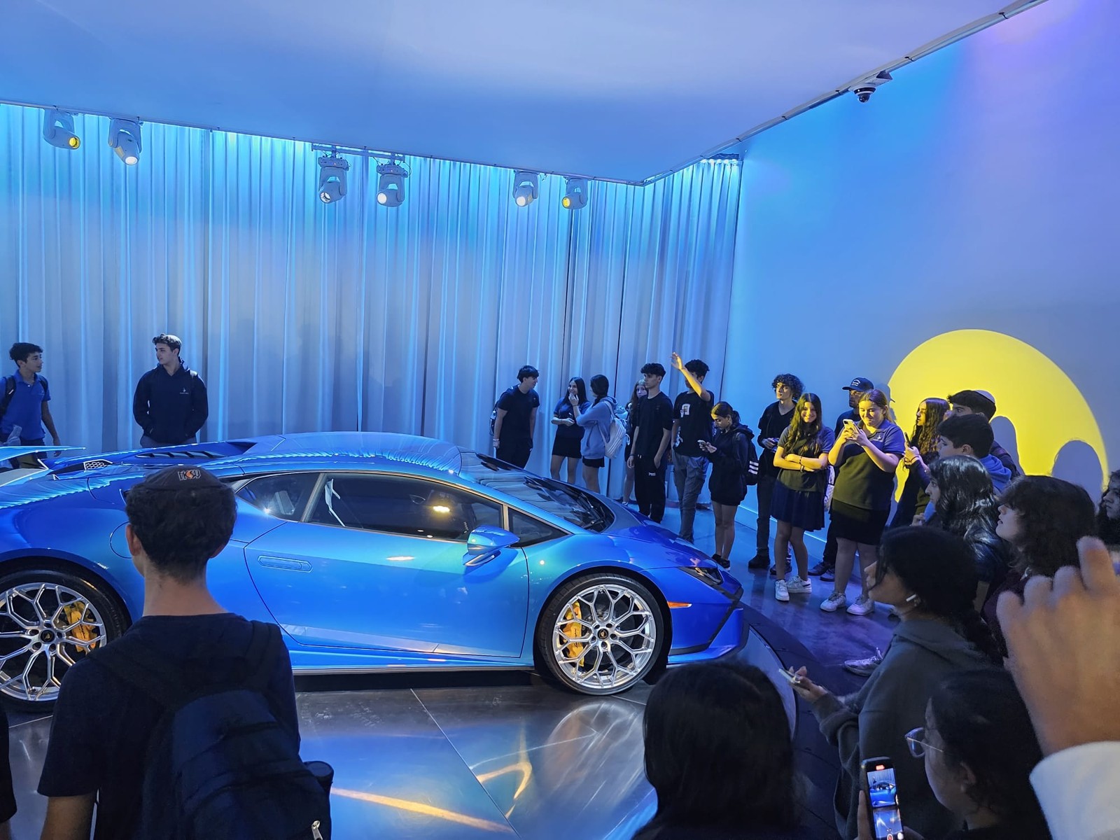 Landow students with a Lamborghini during their Prestige Worldwide visit